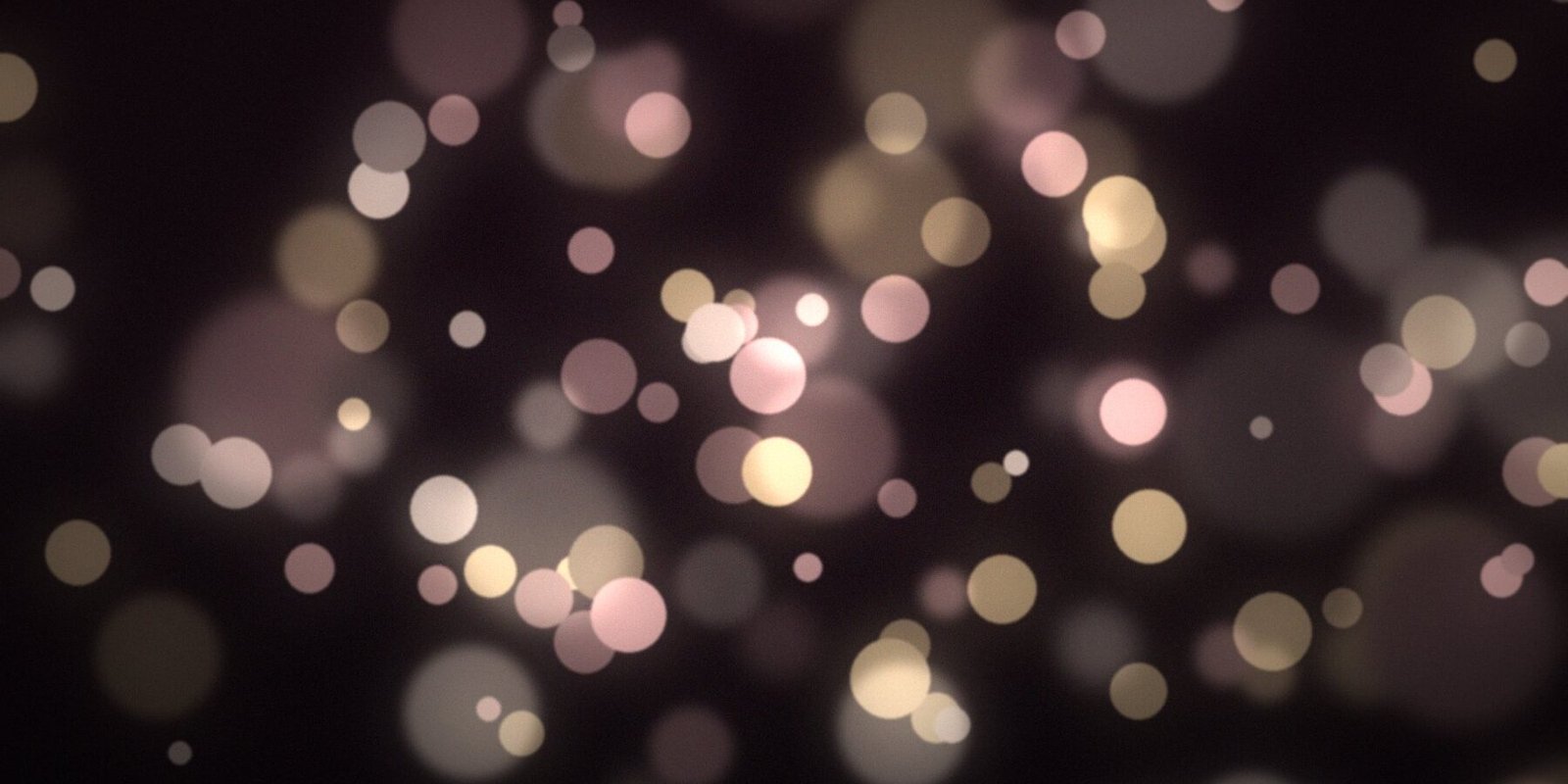Soft ivory and rose lights at an evening reception
